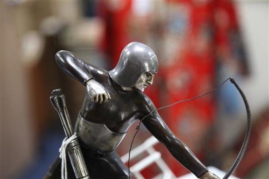F.H.Danvin. A French Art Deco parcel silvered and patinated bronze figure of a medieval archer, width 11.75in. height 10.25in.